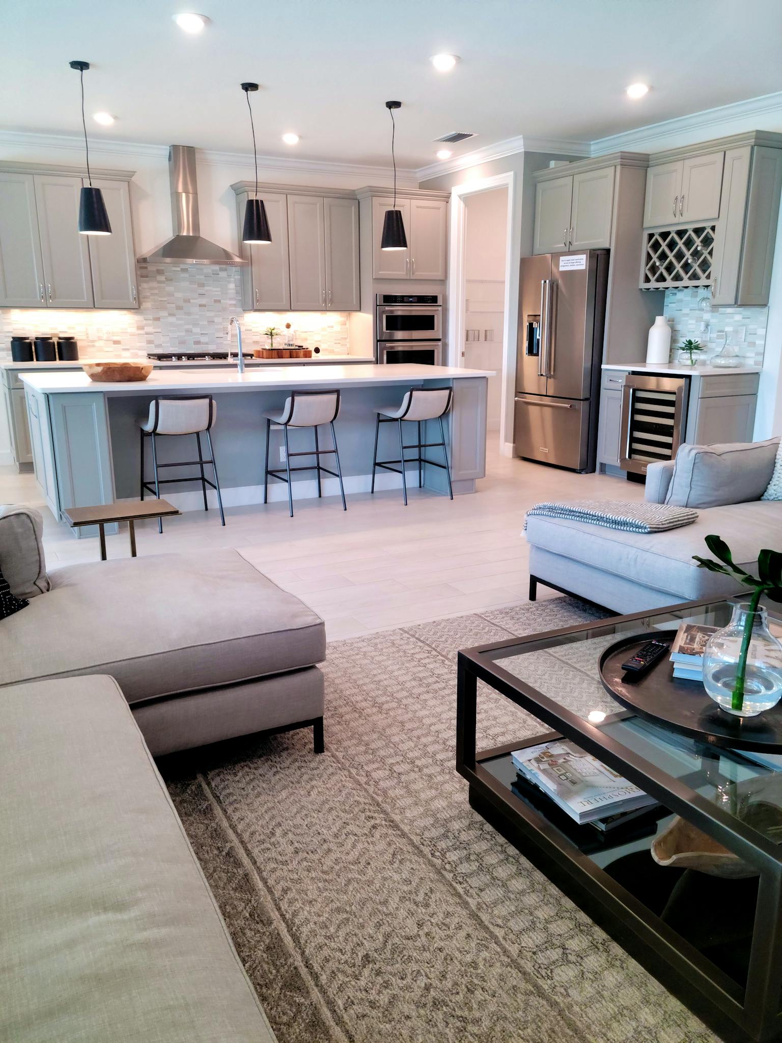 Elegant open-plan kitchen and living area with contemporary design and decor.